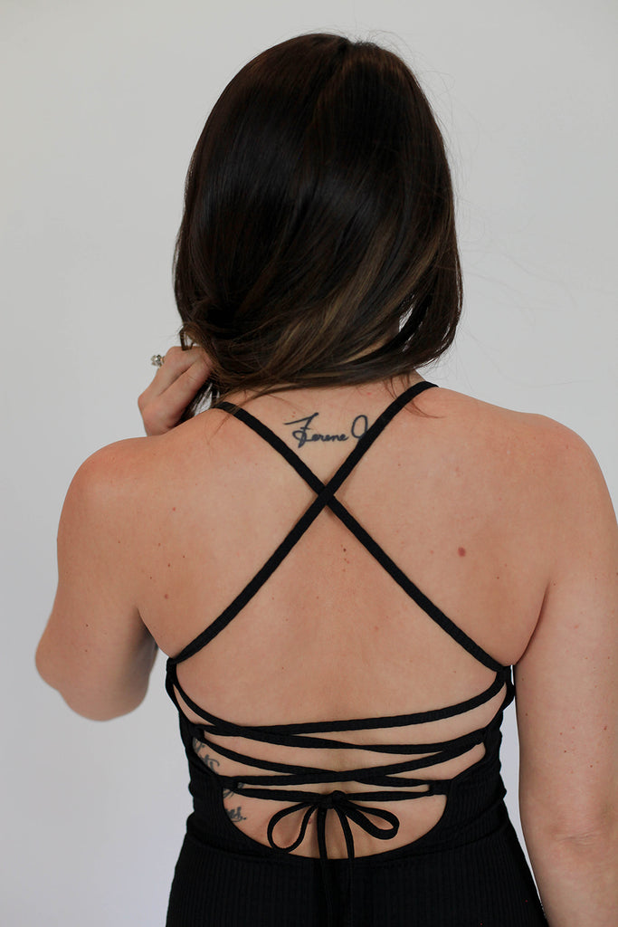 Lace up back detail on swimsuit by June Loop